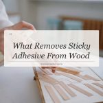 what removes sticky adhesive from wood